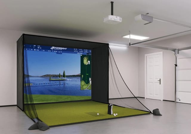 An indoor GCQUAD SIG10 golf simulator set up