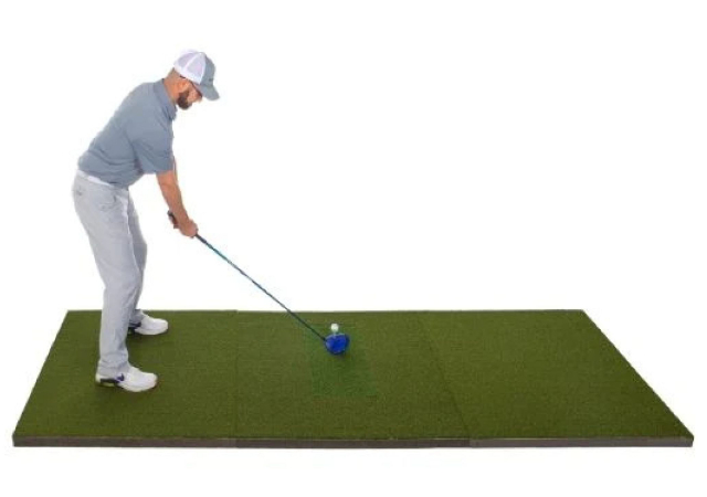A golfer on a teeing mat on white background