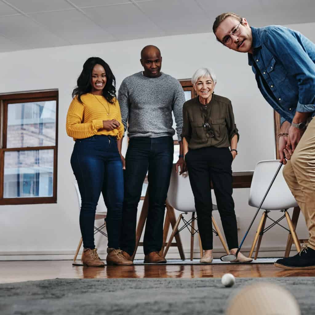 Persons enjoying indoor golf