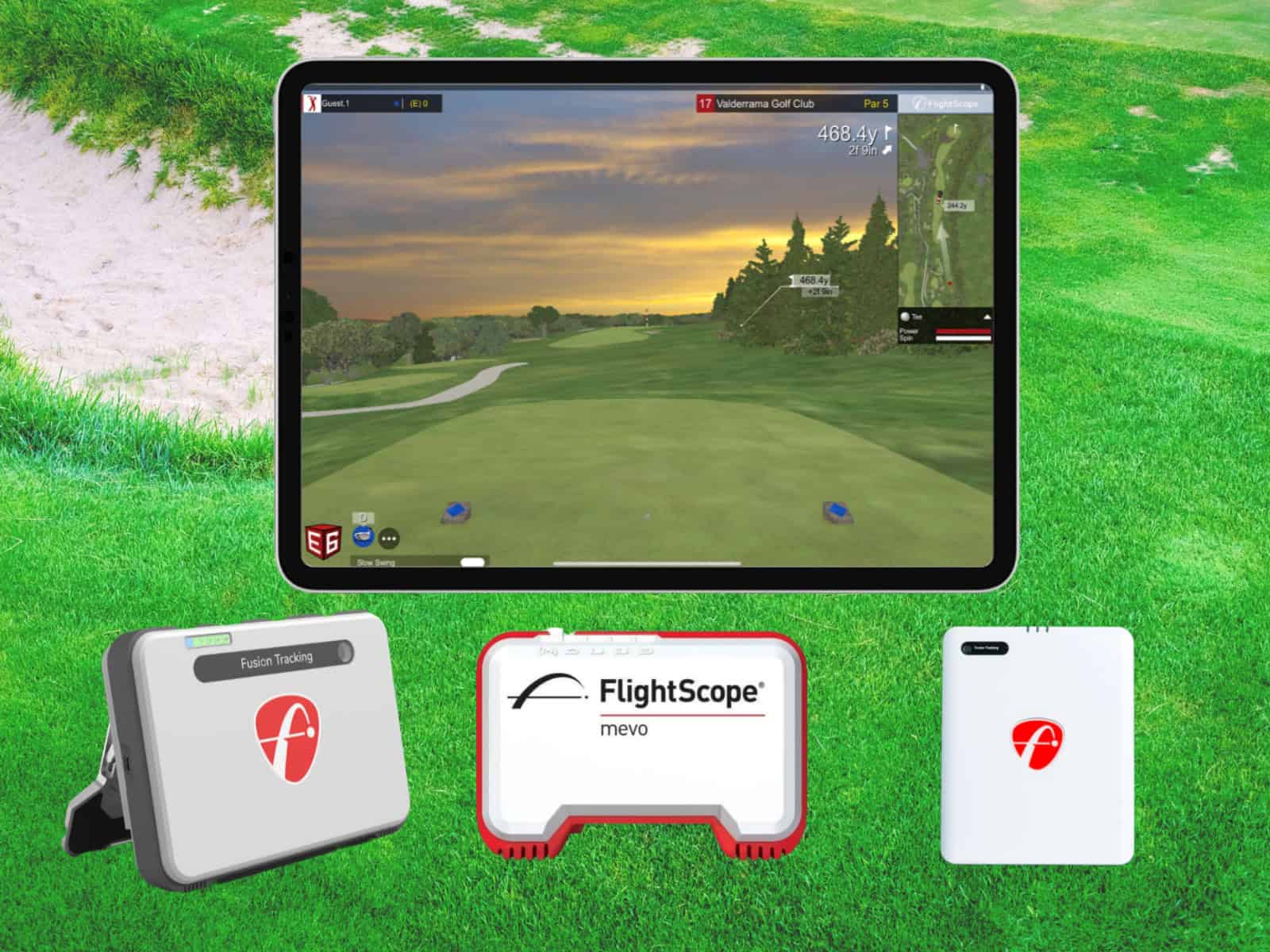 Golf simulator setup with flight scope, launch monitor, and golf course display for indoor golf practice and swing analysis.